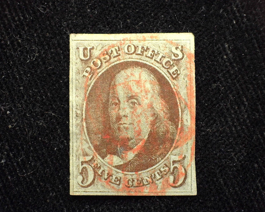 #1 1847 Issue Large equally balanced 4 margin stamp. Brown color with red grid cancel. Lovely stamp. Used XF US Stamp