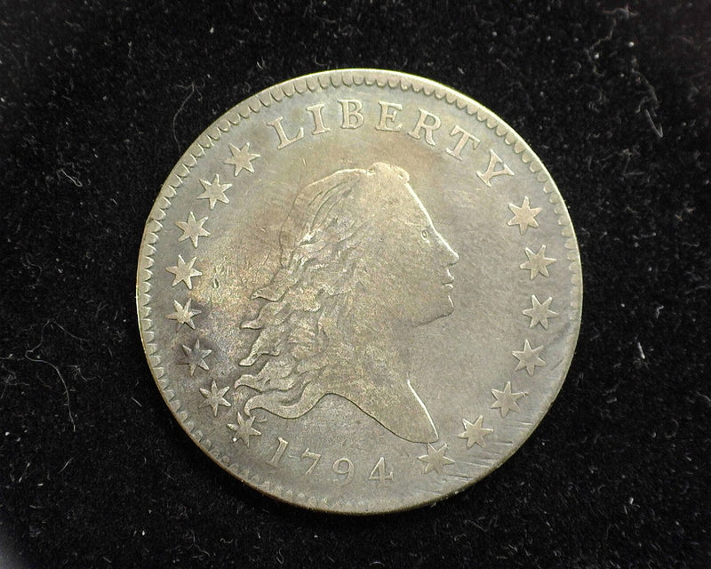 1794 Flowing Hair Half Dollar F. Eye pleasing first year coin with the usual characteristics. Upper end of fine details. Mintage 23,464. Approximately 5,000 circulated half dollars are known to exist. Lovely date coin. - US Coin