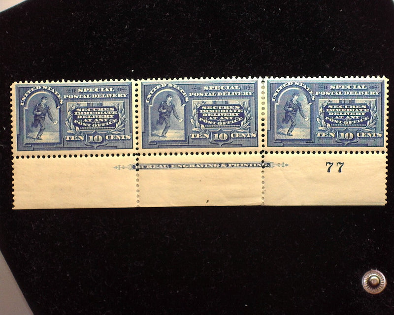 #E5 10c Special Delivery Bottom margin strip of 3, imprint and PL#77. Outstanding color and freshness, pretty show piece. Mint Vf LH - US Stamp