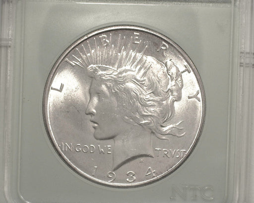 HS&C: 1934 D  Peace Dollar NTC MS-65  We figure MS-64 Coin